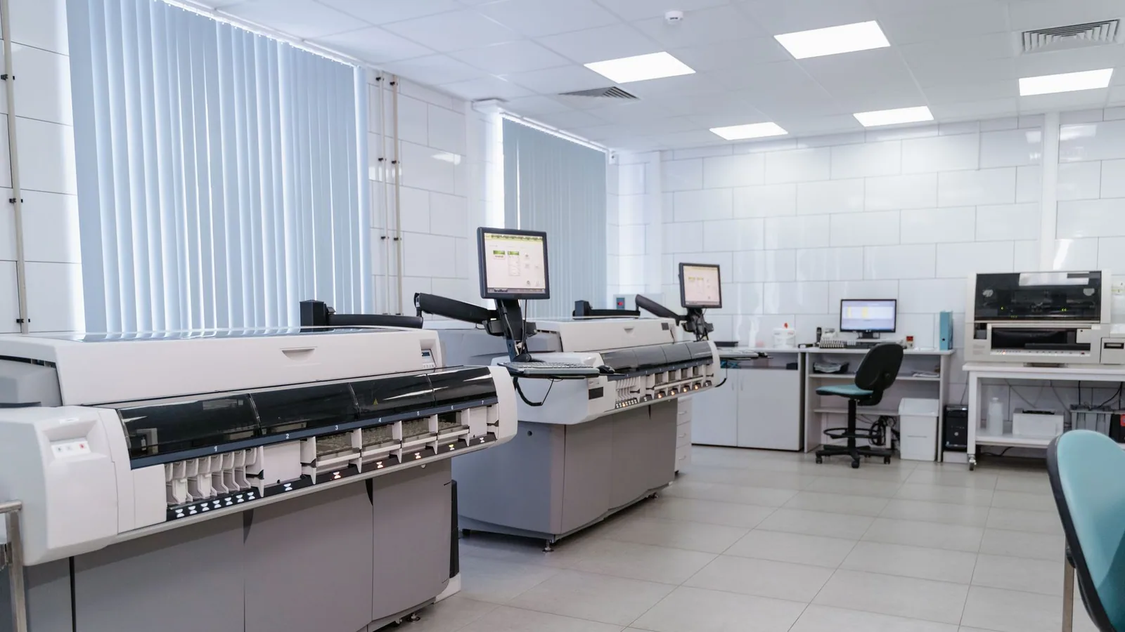 Spacious laboratory interior featuring state-of-the-art machines and computers for research purposes